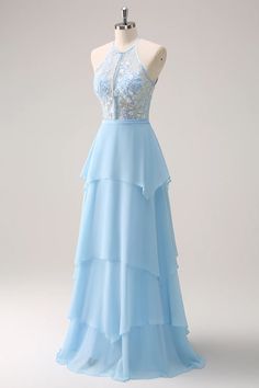 a light blue dress on a mannequin with white lace and beadings