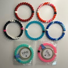 7 Lokai Bracelets! Colorful (Red, Red/White/Pink, Black/White, Blue, Dark Blue/Light Blue, Teal, Pink) 2 Are Brand New In Packaging With Tags! “The White Bead Is Infused With Water From Mt. Everest, The Highest Point On Earth. The Black Bead Carries Mud From The Dead Sea, The Lowest Point On Our Planet.” Casual Multicolor Wristband For Everyday, Casual Pink Wristlet As Gift, Casual Pink Wristlet For Gift, Casual Pink Wristband For Everyday, Casual Friendship Bracelets, Mt Everest, Dead Sea, Blue Teal, White Beads