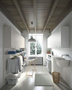 a room with white walls and wooden ceiling