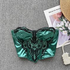 Low-cut Crop Top For Party, Party Low-cut Crop Top With Built-in Bra, Elegant Low-cut Crop Top For Party, Green Fitted Corset For Night Out, Elegant Fitted Green Crop Top, Lace Tube Top For Parties, Lace Tube Top For Party, Green Sleeveless Party Corset, Elegant Green Crop Top For Night Out