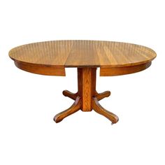 a round wooden table with four leaves on the top and one leaf at the base