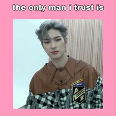 a man with grey hair wearing a brown and black checkered shirt that says, the only man i trust is