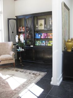 a living room filled with furniture and decor