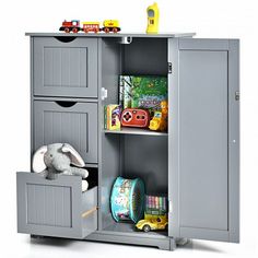 a toy storage cabinet with two doors and shelves for children's toys, including a stuffed animal