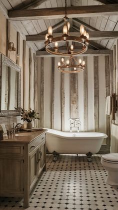 an old fashioned bathroom with a claw foot tub and chandelier over the sink