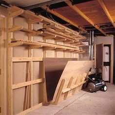 an unfinished room with shelves and tools in it