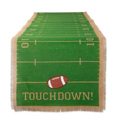 a green table runner with a football on it and the words touchdown written in white