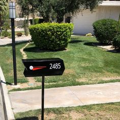 a mailbox in front of a house with the number 2405 on it