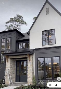 a house that has been painted gray and white