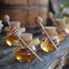 honey jars with wooden spoons filled with honey