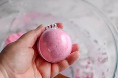 hand holding bath bombs in a mold Recipes Kids Can Make