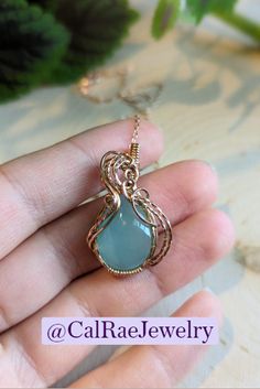 Rose Gold Filled wire wrapped around a soft teal Chalcedony stone. This is a gorgeous and elegant piece. It is so unique and pleasant to look at. The rose gold and teal work so well together, and make for a beautiful necklace. Elegant Wire Wrapped Chalcedony Jewelry, Wire Wrap Necklace, Wrap Necklace, Chalcedony Stone, Wire Wrapped Necklace, Find Picture, Beautiful Necklace, The Rose, Wire Wrap