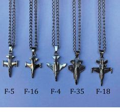 four different types of necklaces with airplanes on them