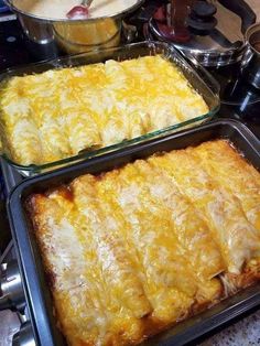 two pans filled with food sitting on top of a stove next to each other