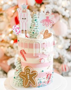 a decorated christmas cake with gingerbreads and decorations