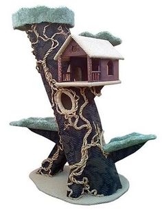 a tree house with a chain hanging from it's side