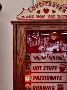 a wooden frame with signs and candles in front of a store sign that says lovettters, see how you rate