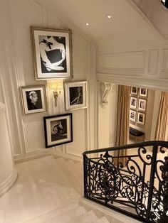 a staircase with pictures hanging on the wall