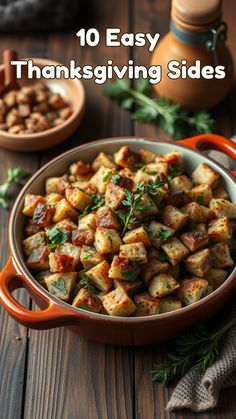 a pan filled with potatoes and herbs on top of a wooden table next to other dishes