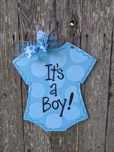 it's a boy door hanger with polka dots and a bow on the front