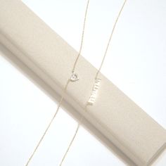 Our mama necklace in solid 14k yellow gold is a treasure that goes beyond its material value, serving as a heartfelt homage to the timeless bond between a mother and her child. Crafted from the finest 14k yellow gold, this piece offers a warm, gleaming finish that complements any skin tone, making it a versatile addition to any wardrobe. The delicate script that spells out mama is styled in an clean and bold font, which lies gracefully along the collarbone when worn. Details: Solid 14k Yellow Go Dainty 14k Gold Name Necklace For Mom, Everyday 14k Gold Necklace For Mother's Day, Delicate 14k Yellow Gold Heart Necklace, Mother's Day 14k Gold Name Necklace With Delicate Chain, Gold Heart Pendant Name Necklace For Everyday, Dainty 14k Gold Name Necklace With Birthstone, Dainty Diamond Name Necklace In Gold, Dainty Gold Name Necklace With Diamond, Dainty Gold Diamond Name Necklace