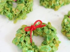 green pretzel wreaths with red ribbon on white counter top, ready to be eaten