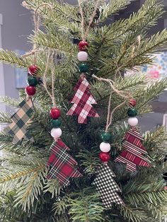 a christmas tree decorated with plaid and red ornaments