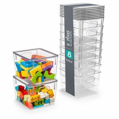 two clear storage containers filled with toys and plastic bins on top of each other