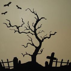 the silhouette of a tree with bats on it and a cemetery in the background is shown