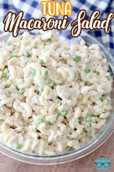 tuna macaroni salad in a glass bowl on a wooden table with text overlay