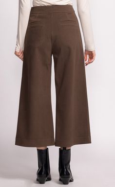 Introducing the Nadia Pants: a chic cropped wide-leg silhouette that pairs effortlessly with anything in your wardrobe. These versatile pants are perfect for casual or elevated looks. Material: 70% Polyester, 20% Polyamide, 10% Cotton Side zip opening Model is wearing XS Versatile Pants, Cute Boots, Dress Gift, Sweater Sale, Outerwear Coats, Denim Pant, Blazer Dress, Cinched Waist, Bottoms Pants