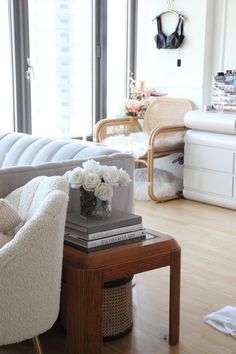 a living room filled with furniture and a large window