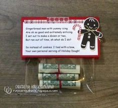 some money wrapped in cellophane and tied to a string with a gingerbread man on it