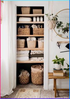 an organized closet with baskets, towels and other household items in it's shelves