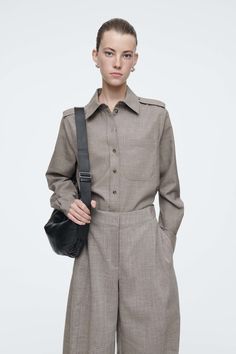 Offered in a lightly flecked pale-brown tone, this shirt is crafted from RWS-certified wool that's blended with linen for a crisp finish. It's designed with a pointed collar, tonal buttons and epaulets at either shoulder that nod to classic trench coats. Regular fitButton closureThis product contains Responsible Wool Standard TE-00047206 (RWS) wool fiber from farms certified to animal welfare and land-management requirements Shell: 90% RWS Wool, 10% Linen. Excluding trims / Dry clean Back length Medium Tv Show, Winter Shopping, Brown Tone, Land Management, Classic Trench Coat, Technology Fashion, Celebrity Lifestyle, Fantasy Gowns, Wool Shirt