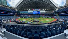 an empty baseball stadium filled with blue seats