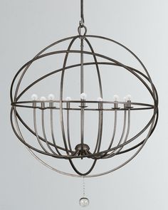 an orb chandelier hanging from a ceiling