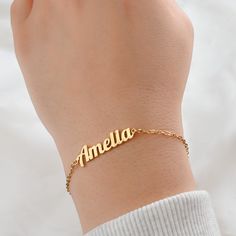 *Free TRACKABLE shipping within Canada and US.  This beautiful bracelet features a custom name charm made from silver and 18k gold PVD plated stainless steel and 9 different chain types to choose from. Available in lengths of 6 to 8 inches. A lovely gift or a special treat for yourself! Font type in photos: Amelia: Font 2 Sophia: Font 1 Material: Stainless Steel Chain Types: Figaro                         Rolo (2mm)                         Medium Paperclip (3.5x12mm)                         Curb Metal Name Bracelet For Personalized Gift, Personalized Metal Name Bracelet As Gift, Personalized Metal Name Bracelet Gift, Personalized Name Bracelet In Stainless Steel, Metal Bracelets For Personalized Gifts, Personalized Metal Bracelets With Nameplate, Custom Name Metal Bracelet As Personalized Gift, Personalized Metal Bracelets As Gifts, Custom Name Metal Bracelet For Personalized Gift