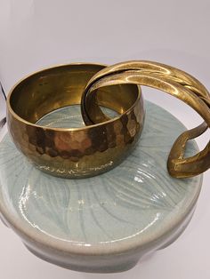 Set of two vintage Brass bracelets.   One is hammered Brass and is approximately 1.5 inches in width.   The other one is a modernist design and is signed.   Both are in good condition.   Keep the vintage patina or polish them for a shiny look. Hammered Bronze Metal Bracelets, Bronze Hammered Metal Bracelets, Vintage Hand Forged Brass Bracelets, Brass Bracelet, Wedding Jewelry Bracelets, Wedding Bracelet, Vintage Brass, Wedding Jewelry, Bundles