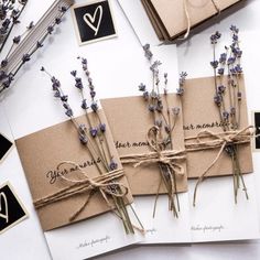 three cards tied up with twine and lavender flowers