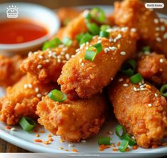 some fried food on a white plate with sauce