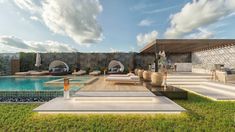 an outdoor pool area with lounge chairs, tables and umbrellas on the grass next to it