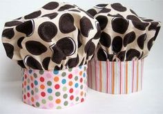 two cupcakes with polka dots on them sitting side by side in paper cups