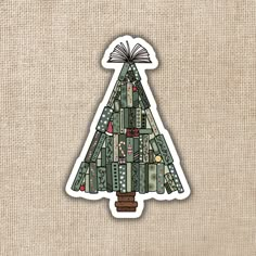 a christmas tree sticker on a burlap background