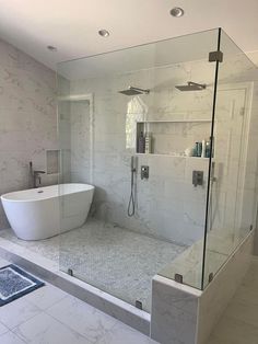 a bathtub and shower in a white bathroom