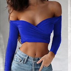 Blue Off Shoulder Sexy Crop Top . Stretchy Material Can Fit A Body Frame From Size Medium Up To Size Xtra Large . Trendy Low-cut Crop Top For Club, Blue Stretch Crop Top For Club, Stretch Low-cut Party Tops, Blue Fitted Flirty Top, Blue Flirty Fitted Tops, Blue Crop Top For Club In Spring, Stretch Low-cut Crop Top For Night Out, Low-cut Blue Summer Tops, Blue Crop Top For Club And Spring Season