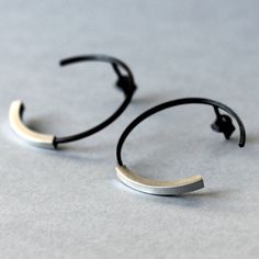 Large sterling silver hoop earrings, made of oxidized matte black silver. They are light and comfortable. They are good for any ocassion and fits most of outfits. If you like simple geometric forms in jewelry, they are perfect choice for you. Diameter: 30 mm Enjoy colorful world of Shambala A few words about our works: All of the products in gallery are designed by us. Our studio is located in the beautiful seaside city of Gdańsk at Świętokrzyska Street. Everything is 100% handmade, with special Modernist Earrings, Punk Earrings, Big Hoop Earrings, Open Hoop Earrings, Geometric Forms, Earrings Geometric, Men Earrings, Sterling Silver Hoop Earrings, Modern Earrings