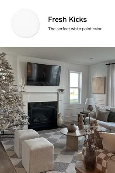 the living room is decorated in white and has a christmas tree