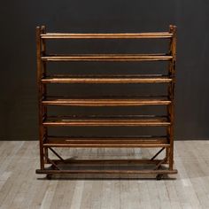 an old wooden rack with six shelves on it