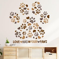 the love has four paws wall decal is shown